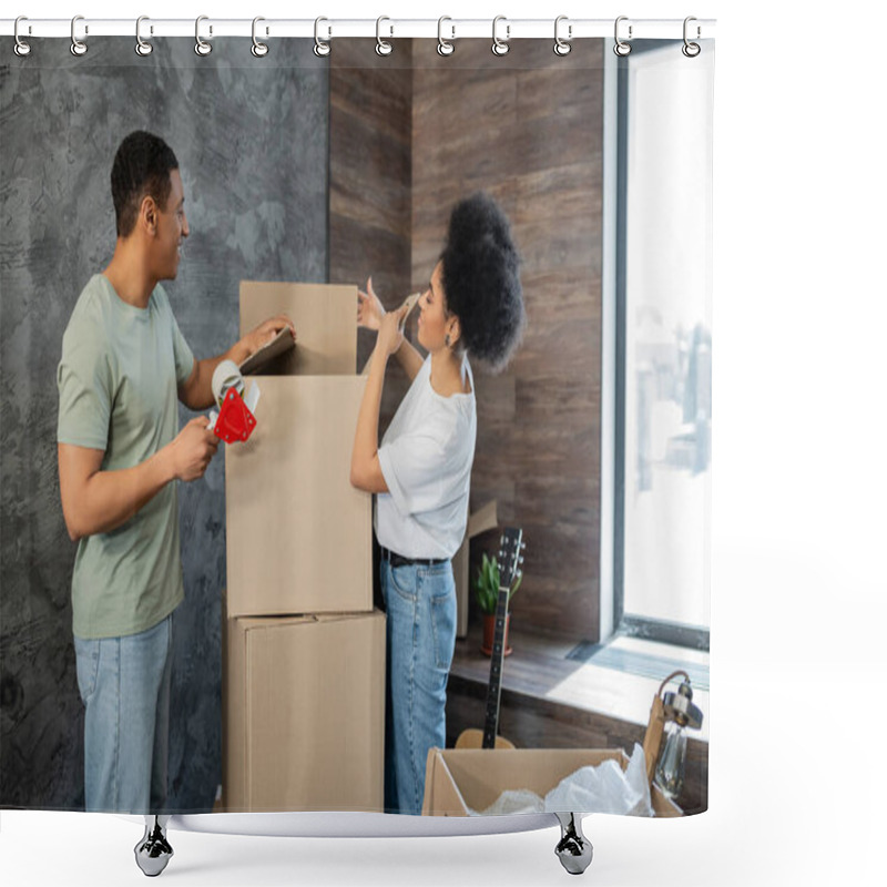 Personality  Side View Of Happy African American Couple With Adhesive Tape Packaging Boxes During Moving Shower Curtains