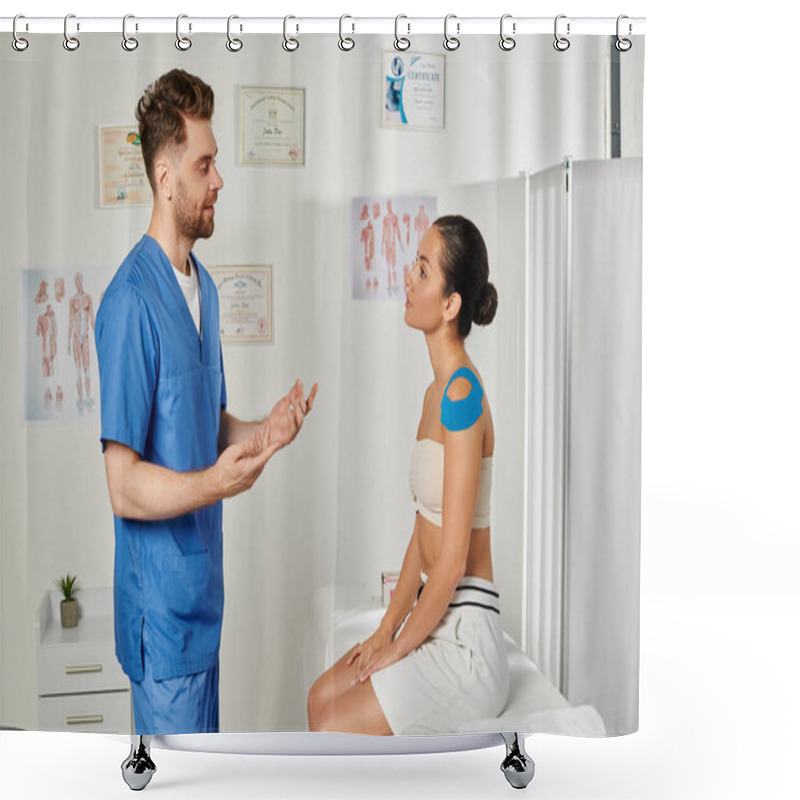 Personality  Good Looking Bearded Doctor Talking To His Young Female Patient With Kinesio Tapes On Shoulder Shower Curtains