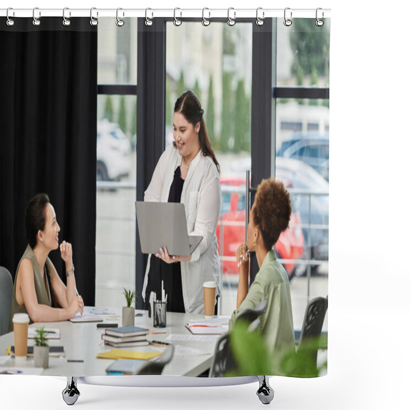 Personality  A Confident Businesswoman Presents Ideas On Her Laptop To Engaged Colleagues In An Office. Shower Curtains