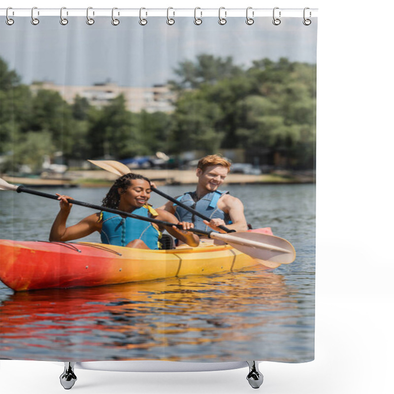 Personality  Carefree Interracial Couple In Life Vests Holding Paddles And Looking At Clear Water While Sailing In Sportive Kayak During Recreation Weekend On Summer Day Shower Curtains