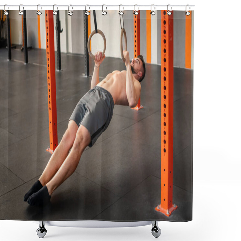 Personality  Side View Of Strong Shirtless Bearded Adult Male Athlete In Shorts Looking Up While Doing Calisthenics Ring Row Exercise In Gym With Equipment In Daytime Shower Curtains