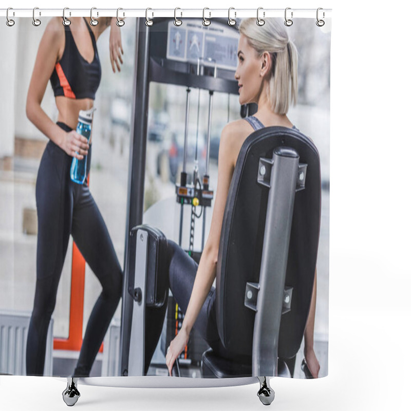 Personality  Attractive Athletic Woman Working Out With Gym Machine While Her Partner Resting With Water Bottle Next To Her At Gym Shower Curtains