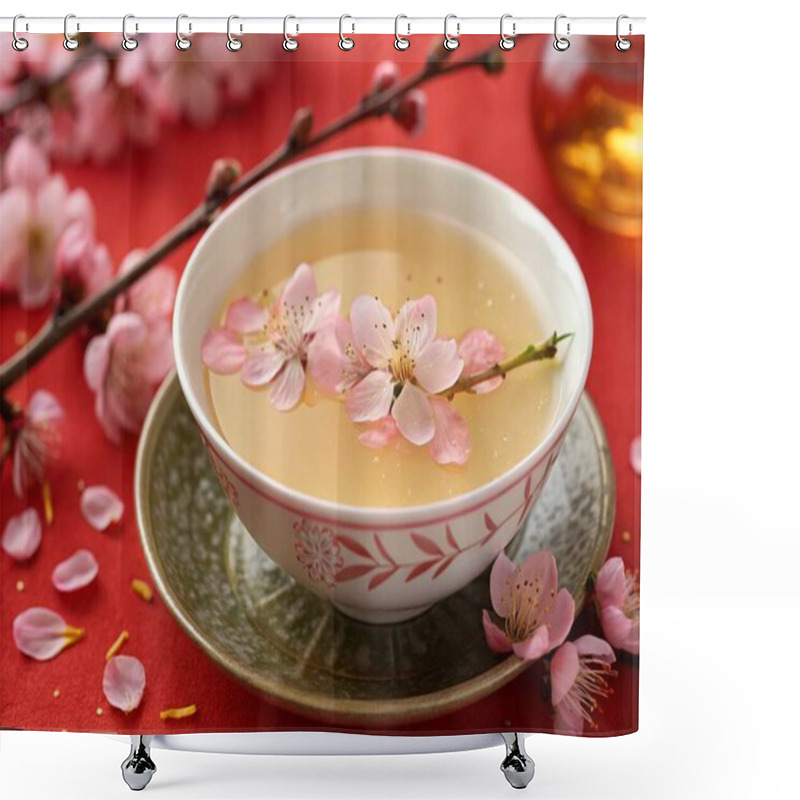 Personality  A High-resolution Photograph Showcasing A Traditional East Asian-style Tea With A Light, Translucent Broth And Delicate Pink Flower Petals, Including Small Blossoms With Intricate Yellow Stamens, Adorning The Surface. The Setting Is A Festive One, Wi Shower Curtains