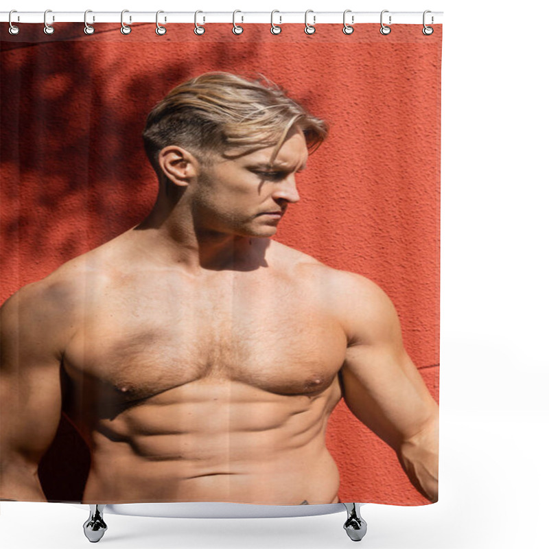 Personality  A Shirtless, Muscular Blonde Man With A Defined Six-pack Poses Against A Red Wall, Looking Down With A Serious Expression. Shower Curtains