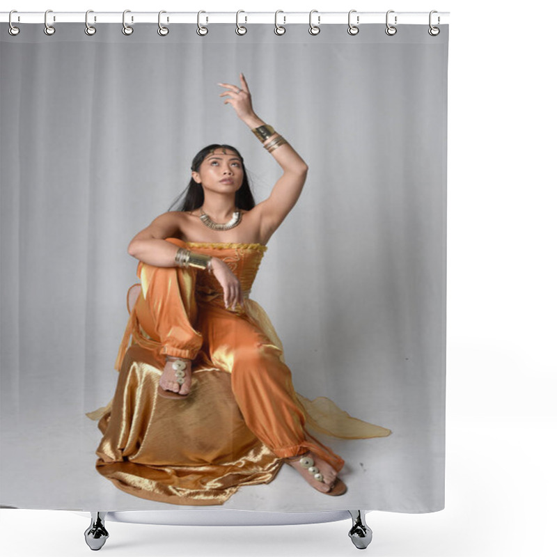 Personality  Full Length Portrait Of Pretty Young Asian Woman Wearing Golden Arabian Robes Like A Genie, Seated Pose, Isolated On Studio Background. Shower Curtains