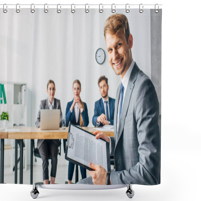 Personality  Selective Focus Of Smiling Employee With Resume Looking At Camera Near Recruiters In Office  Shower Curtains