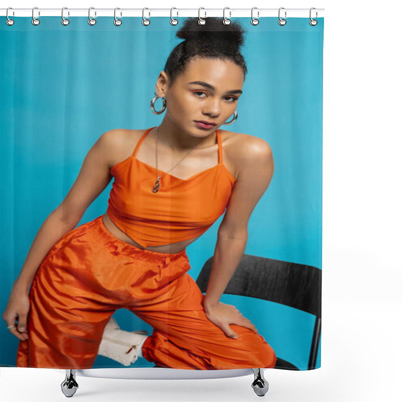 Personality  Beautiful Fashion Model In Orange Outfit Posing On Tall Chair Looking At Camera, Blue Background Shower Curtains