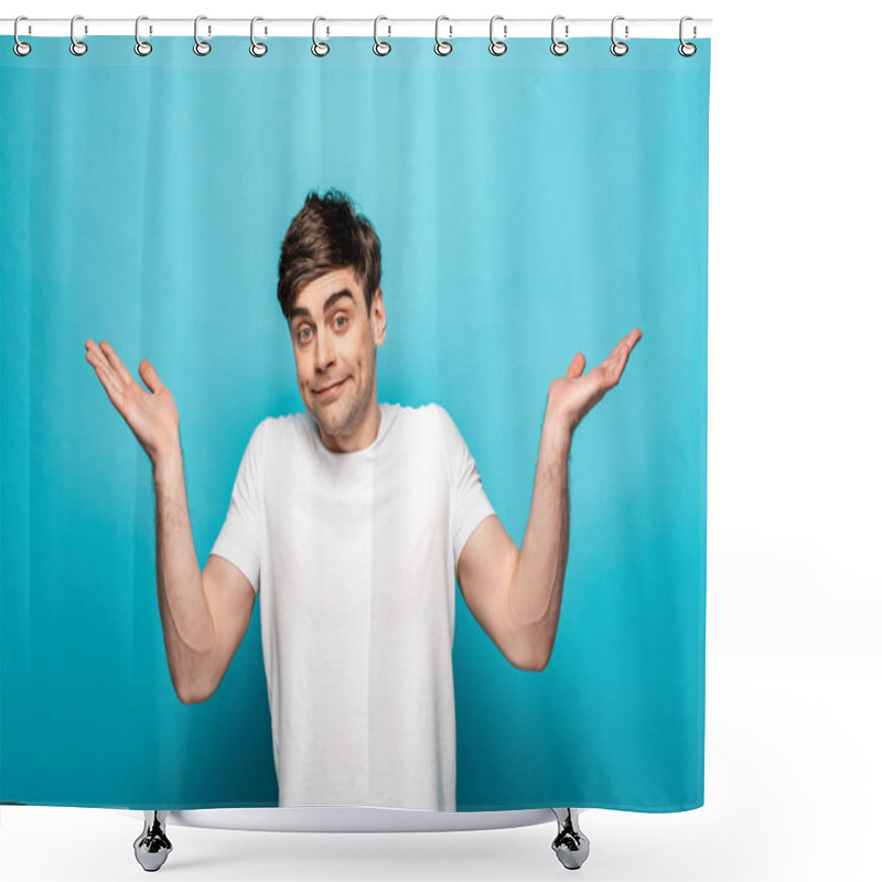 Personality  Disappointed Young Man Looking At Camera And Showing Shrug Gesture On Blue Background Shower Curtains