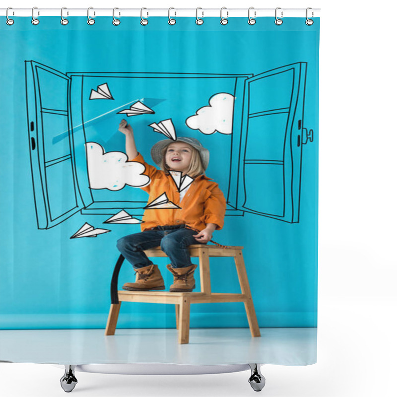 Personality  Excited Kid In Jeans And Orange Shirt Sitting On Stairs And Playing With Blue Paper Plane On Blue Background With Fairy White Window, Paper Planes And Clouds Illustration Shower Curtains