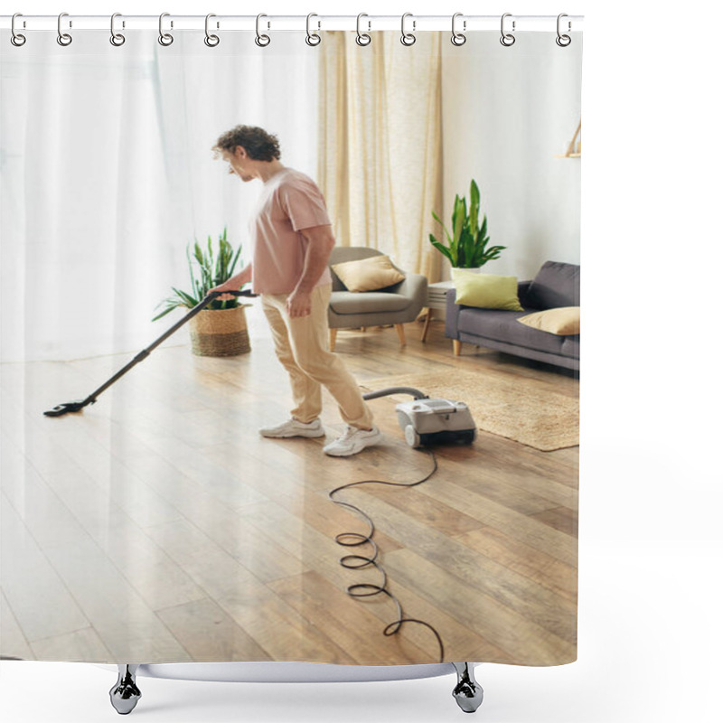 Personality  A Handsome Man In Cozy Homewear Cleans The Floor Using A Vacuum. Shower Curtains