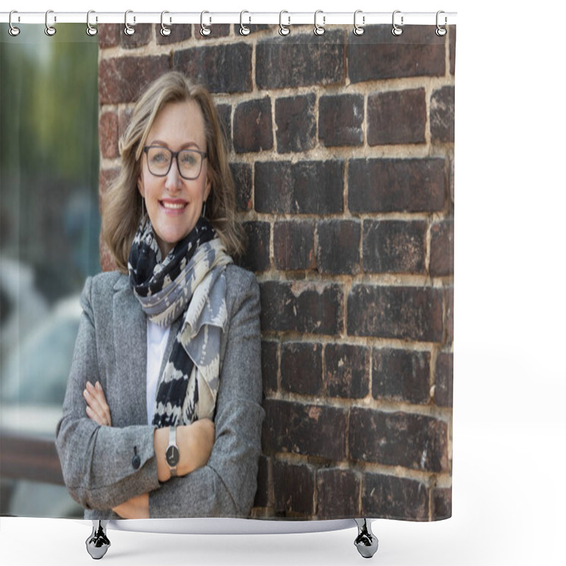 Personality   Portrait Of A Happy Beautiful Woman, 55 Years Old, Smiling. On The Street In The City, On The Background Of The Old Wall Of Red Brick. Shower Curtains