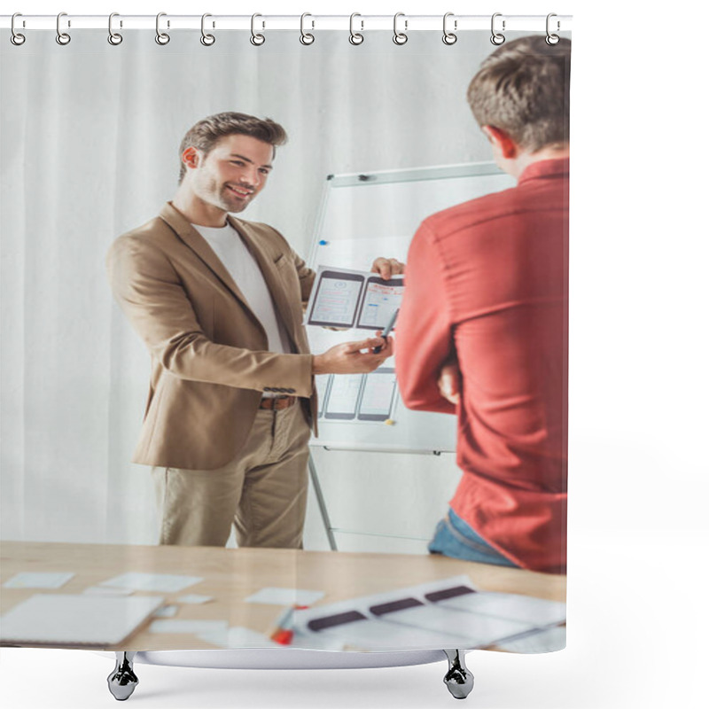 Personality  Selective Focus Of Smiling Designer Showing Screens Of Mobile Responsive Website Development To Colleague In Office Shower Curtains