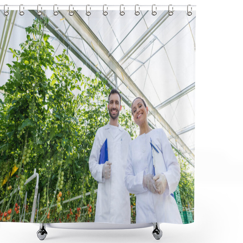 Personality  Low Angle View Of Agricultural Technologists In White Coats Smiling At Camera In Greenhouse Shower Curtains