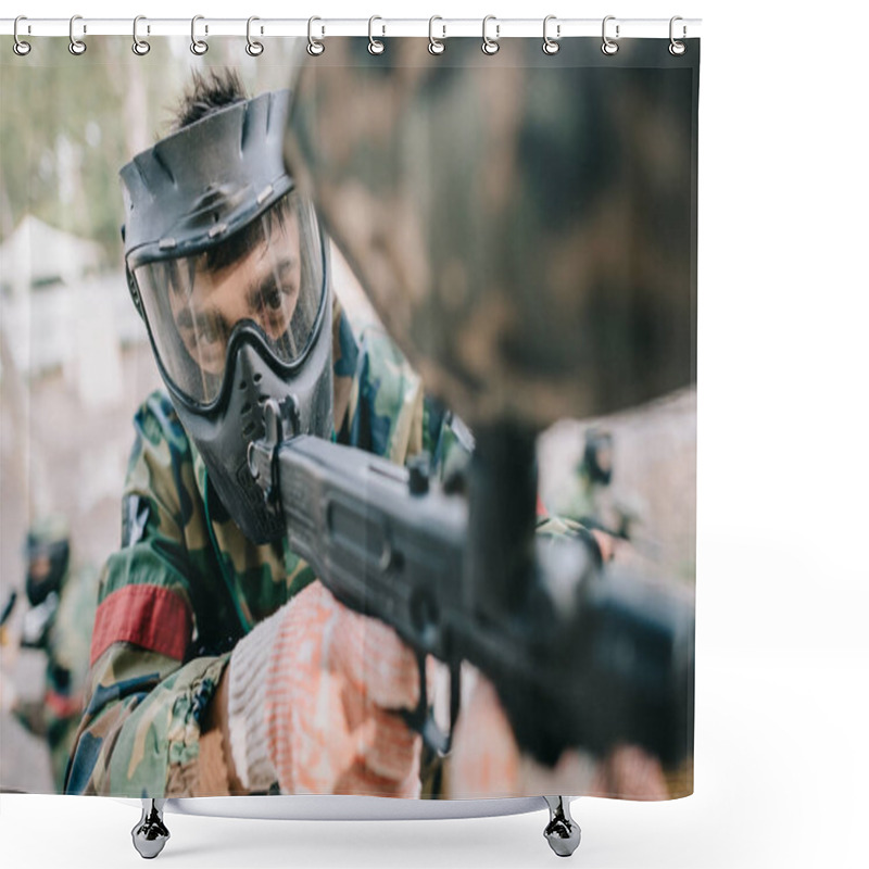 Personality  Selective Focus Of Male Paintball Player In Goggle Mask And Camouflage Aiming By Paintball Gun Outdoors  Shower Curtains