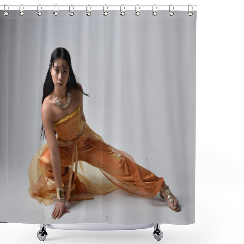 Personality  Full Length Portrait Of Pretty Young Asian Woman Wearing Golden Arabian Robes Like A Genie, Seated Pose, Isolated On Studio Background. Shower Curtains