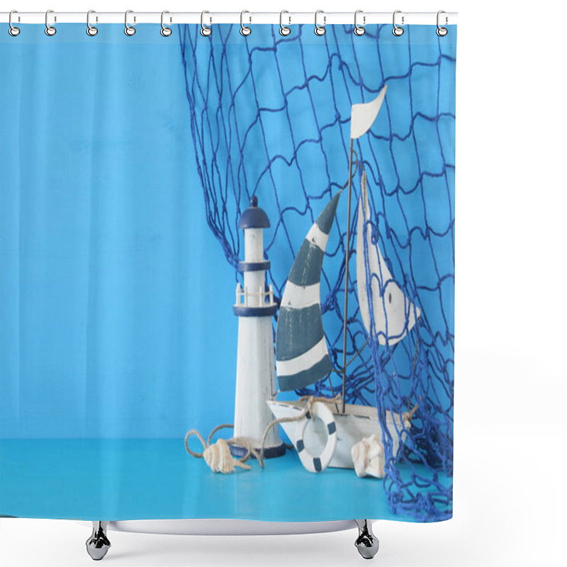 Personality  Nautical Concept With White Decorative Sail Boat, Lighthouse, Seashells And Fishnet Over Blue Wooden Table And Background. Shower Curtains