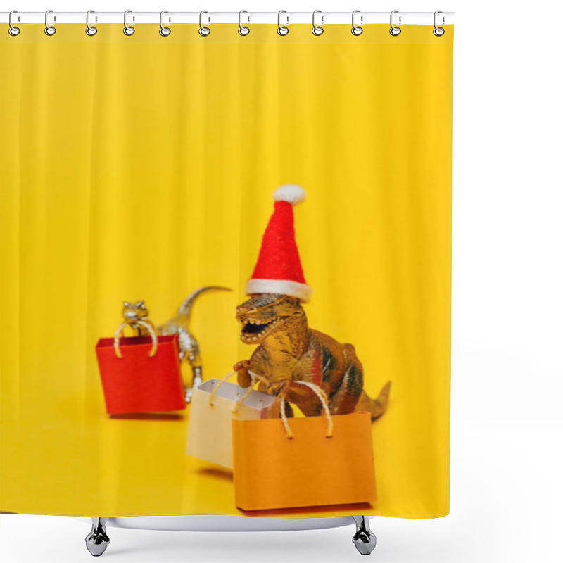 Personality  Selective Focus Of Toy Dinosaurs In Santa Hat And Shopping Bags On Yellow Background Shower Curtains