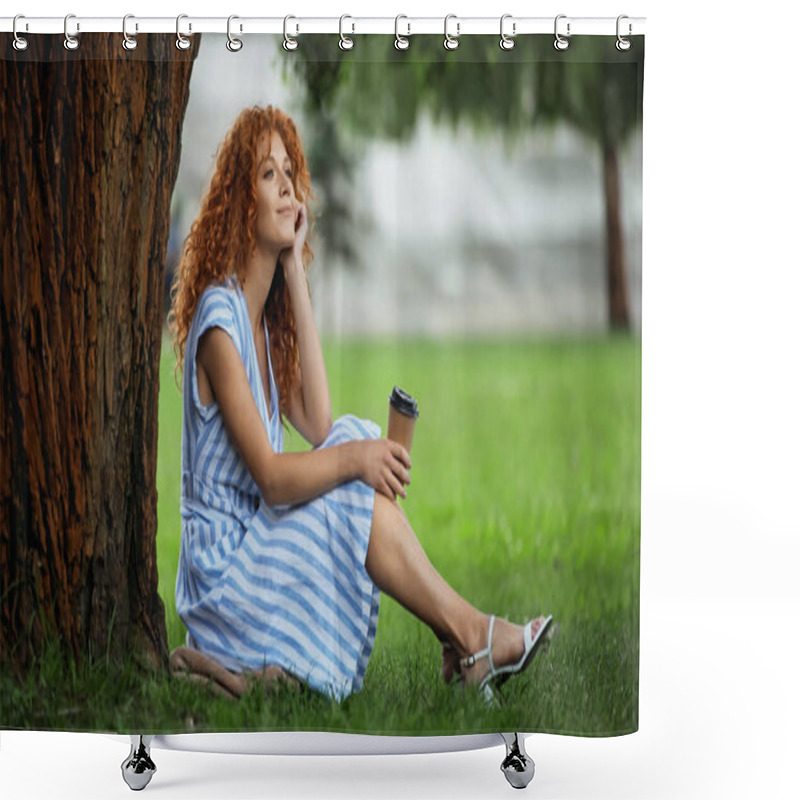 Personality  Dreamy Redhead Woman In Blue Dress Smiling While Sitting Under Tree Trunk And Holding Coffee To Go  Shower Curtains