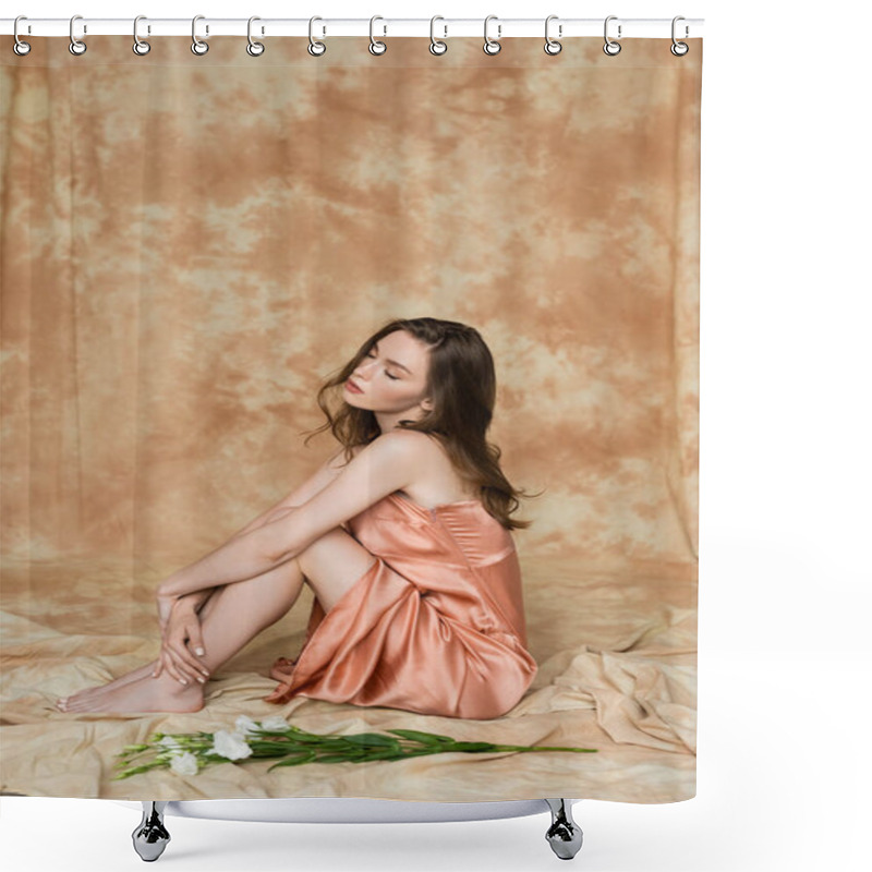 Personality  Full Length Of Stunning And Dreamy Young Woman In Pink Silk Slip Dress Sitting With Closed Eyes Near White Eustoma Flowers On Mottled Beige Background, Sensuality, Elegance, Sophistication  Shower Curtains