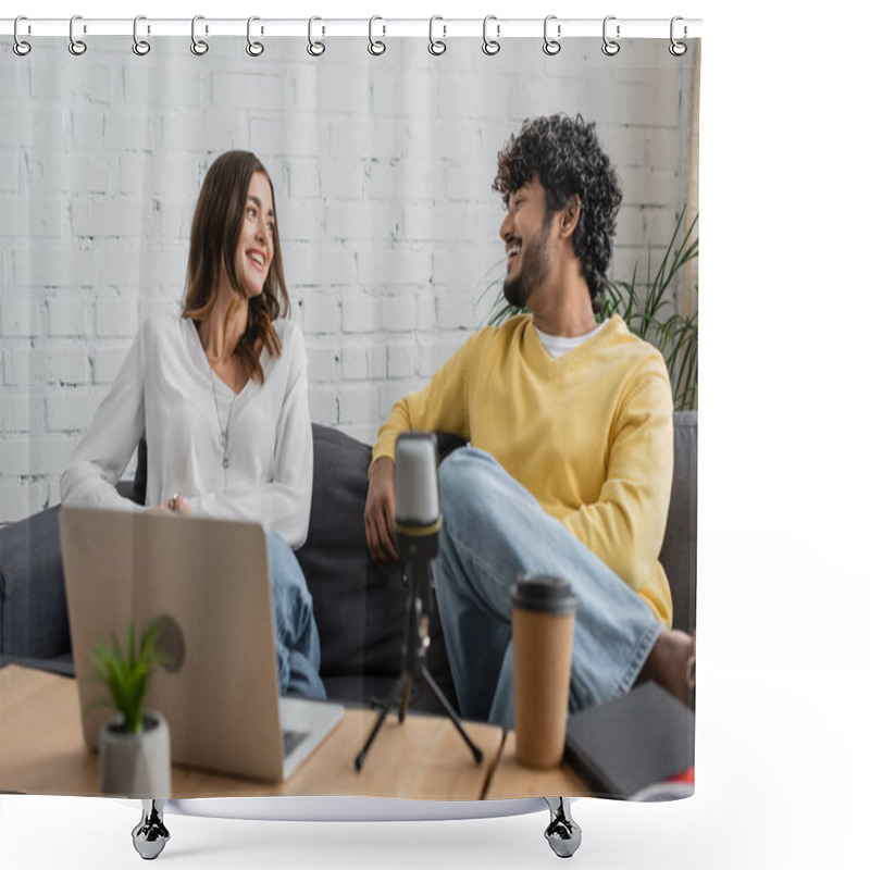 Personality  Joyful Interracial Podcasters Smiling At Each Other During Conversation Near Blurred Laptop And Professional Microphone While Sitting Together On Grey Couch In Studio Shower Curtains