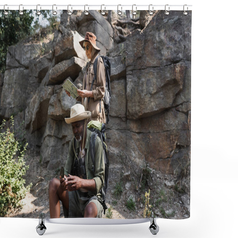 Personality  Senior Multiethnic Hikers Using Map And Compass Near Rock In Forest  Shower Curtains