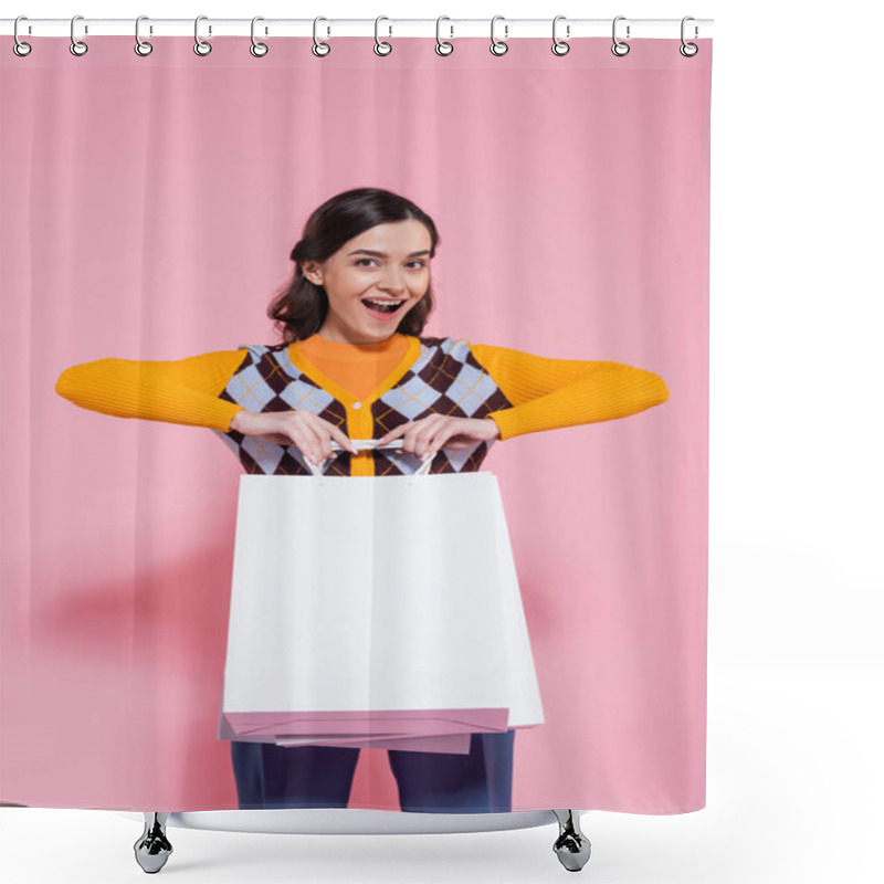 Personality  Excited Woman In Orange Cardigan With Argyle Pattern Holding White Shopping Bags And Looking At Camera On Pink Background Shower Curtains