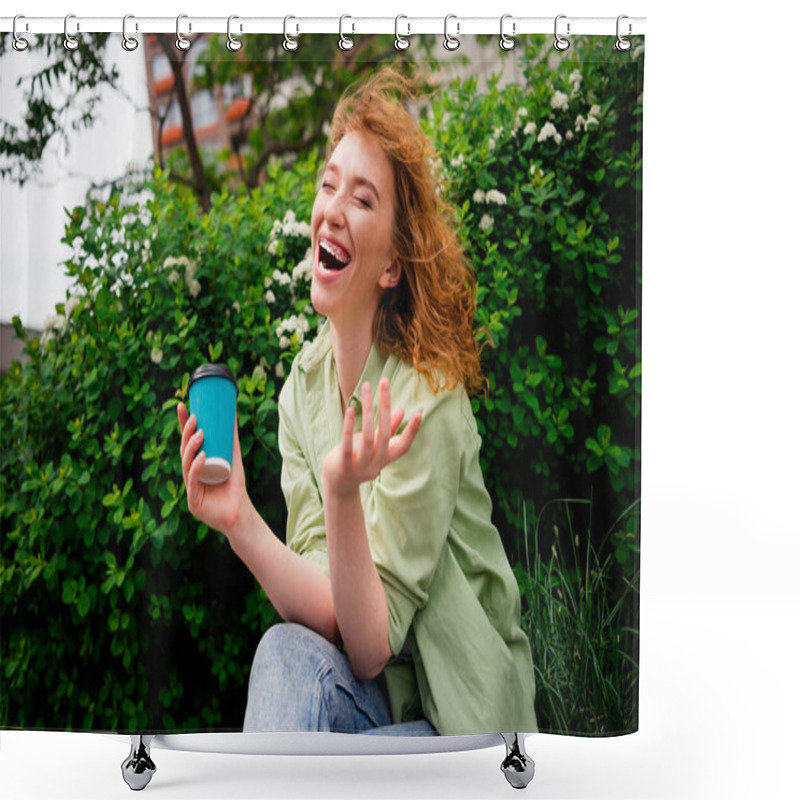 Personality  A Cheerful Young Female Student With Red Hair Laughs Heartily While Sitting Outdoors On A Sunny Day, Holding A Coffee Cup Amidst Lush Greenery. Shower Curtains