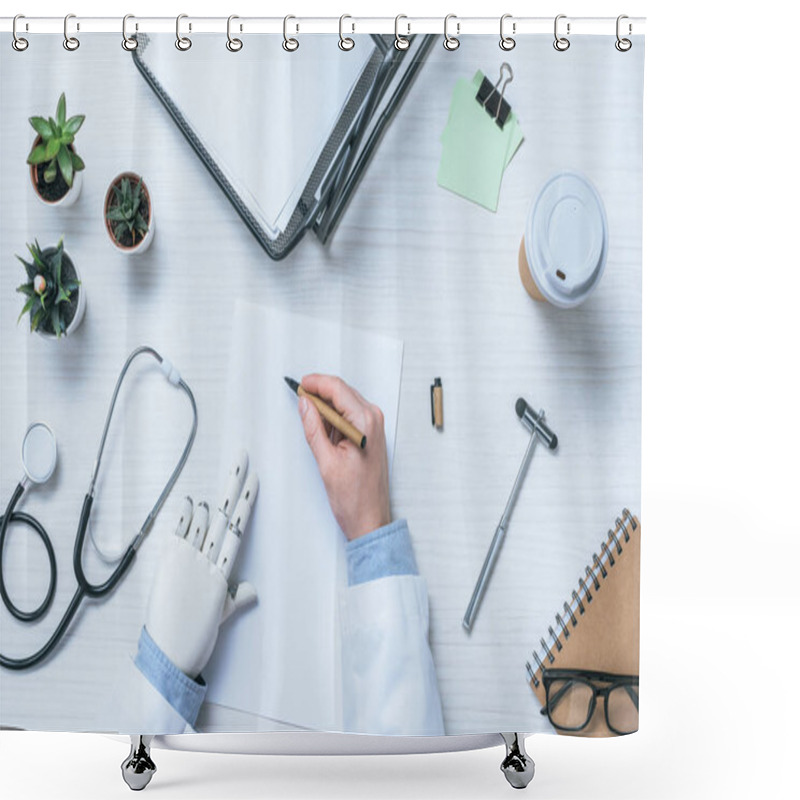 Personality  Cropped Image Of Male Doctor With Prosthetic Arm Writing On Blank Paper At Table With Reflex Hammer, Stethoscope And Coffee Cup  Shower Curtains