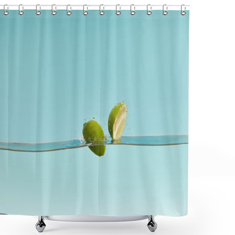 Personality  Ripe Lime Halves Falling In Water On Blue Background Shower Curtains