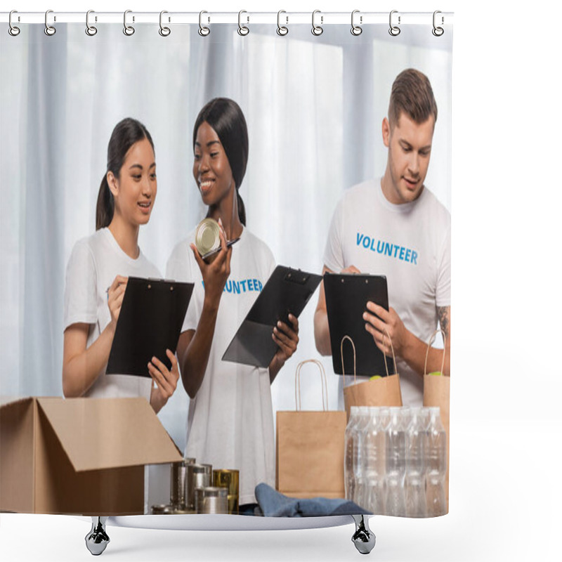 Personality  Selective Focus Of Multicultural Volunteers With Clipboards Standing Near Donations In Charity Center  Shower Curtains