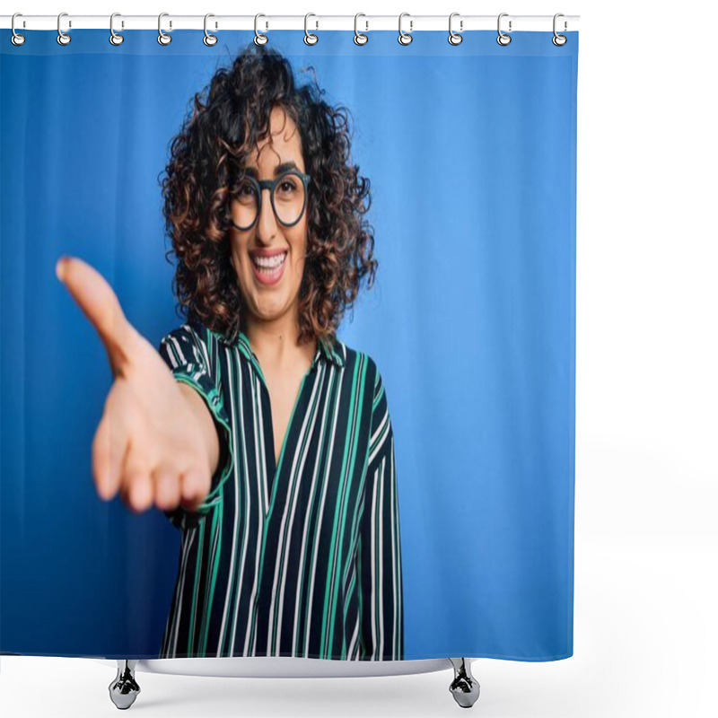 Personality  Young Beautiful Curly Arab Woman Wearing Striped Shirt And Glasses Over Blue Background Smiling Friendly Offering Handshake As Greeting And Welcoming. Successful Business. Shower Curtains