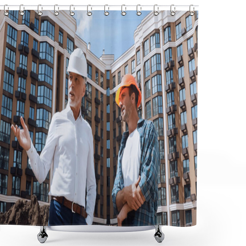 Personality  Low Angle View Of Engineer Gesturing Near Builder While Talking Near New Building Shower Curtains