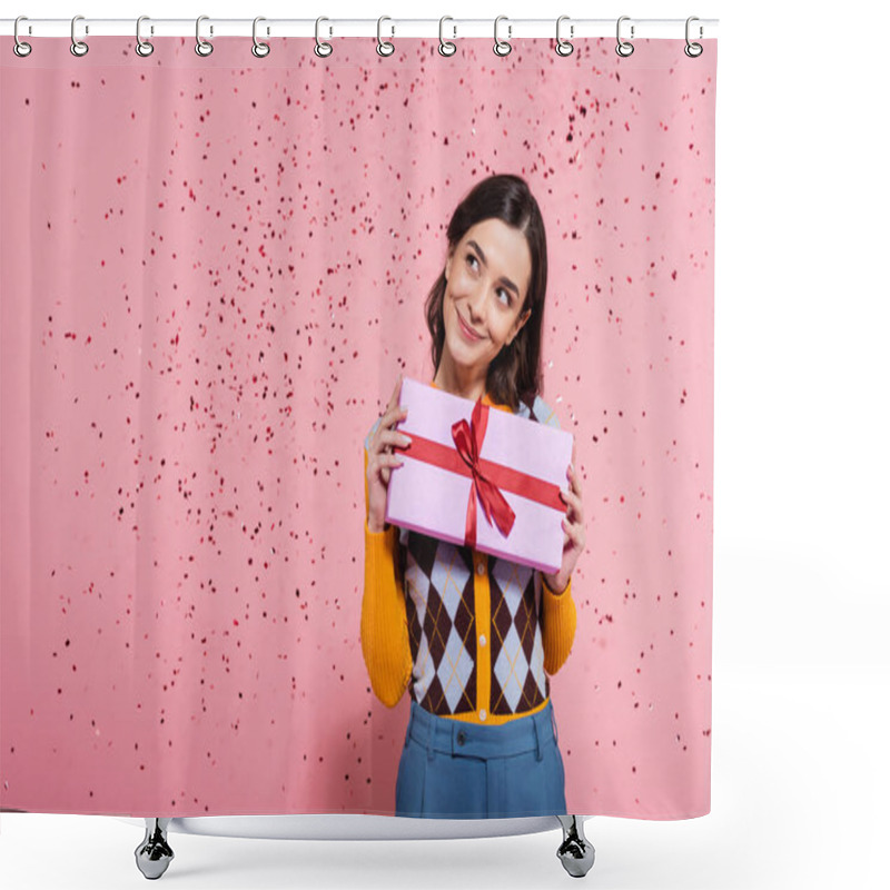 Personality  Happy And Dreamy Woman In Stylish Clothes Holding Present And Looking Away Near Festive Confetti On Pink Background Shower Curtains