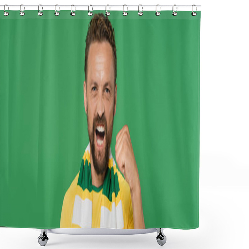 Personality  Emotional Football Fan In Striped Scarf And Yellow T-shirt Looking At Camera And Showing Power Gesture Isolated On Green, Banner  Shower Curtains