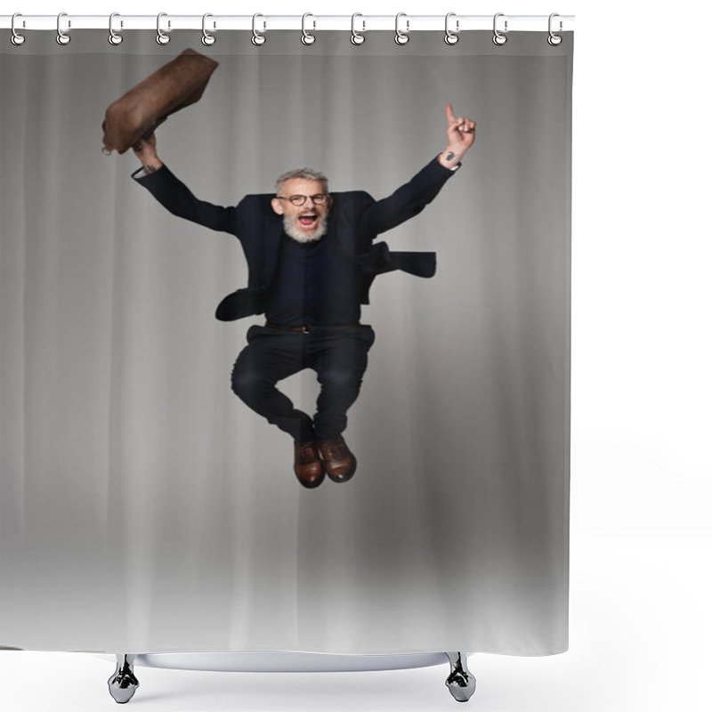 Personality  Full Length Of Amazed Man With Grey Hair Holding Leather Bag While Levitating On Grey Shower Curtains