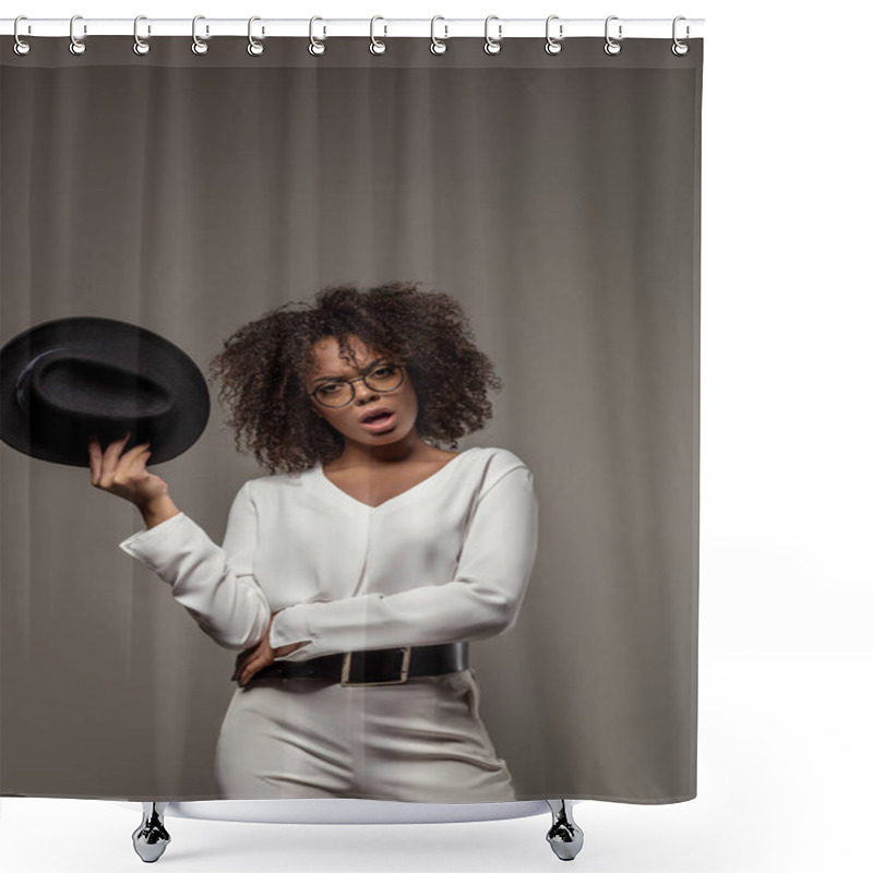 Personality  Young Angry African American Woman In White Shirt Wearing Glasses Holds Hat Isolated On Grey Background Shower Curtains