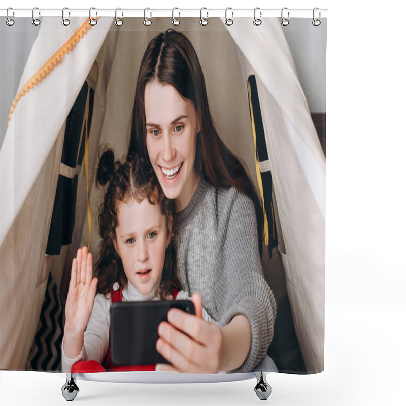 Personality  Positive Young Mum Using Social Media App On Smartphone Recording Video Blog Having Fun With Cute Small Kid Girl Embracing Bonding Together Looking At Mobile Phone, Sitting In Cozy Tent At Home Shower Curtains