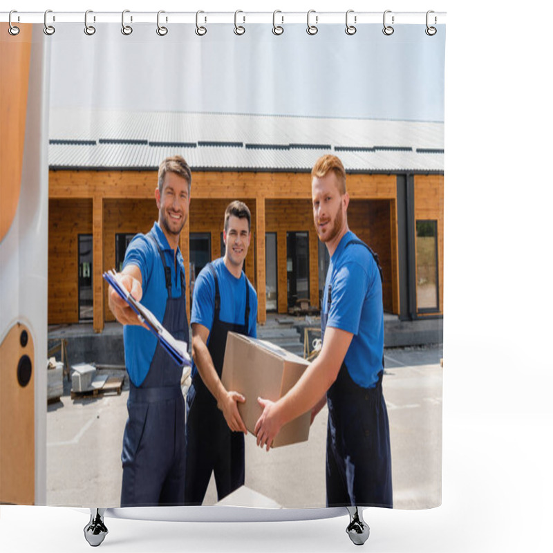 Personality  Selective Focus Of Loader Holding Clipboard Near Colleagues With Cardboard Box And Door Of Truck On Urban Street  Shower Curtains