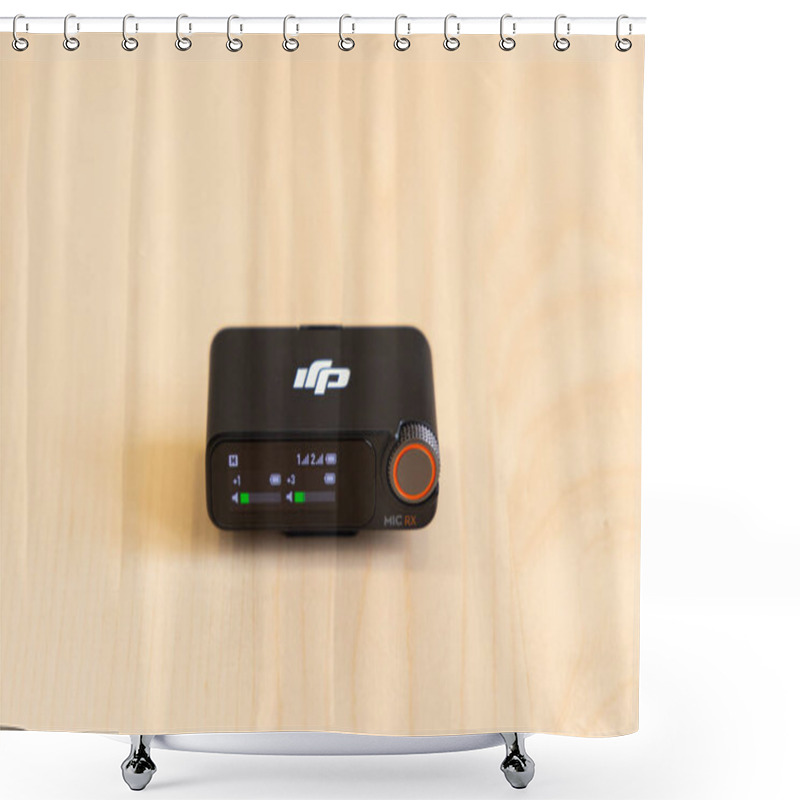 Personality  Bishkek, Kyrgyzstan - November 4, 2024: DJI MIC 2 Receiver With Display Interface Showing Audio Levels And Settings On A Wooden Surface Shower Curtains