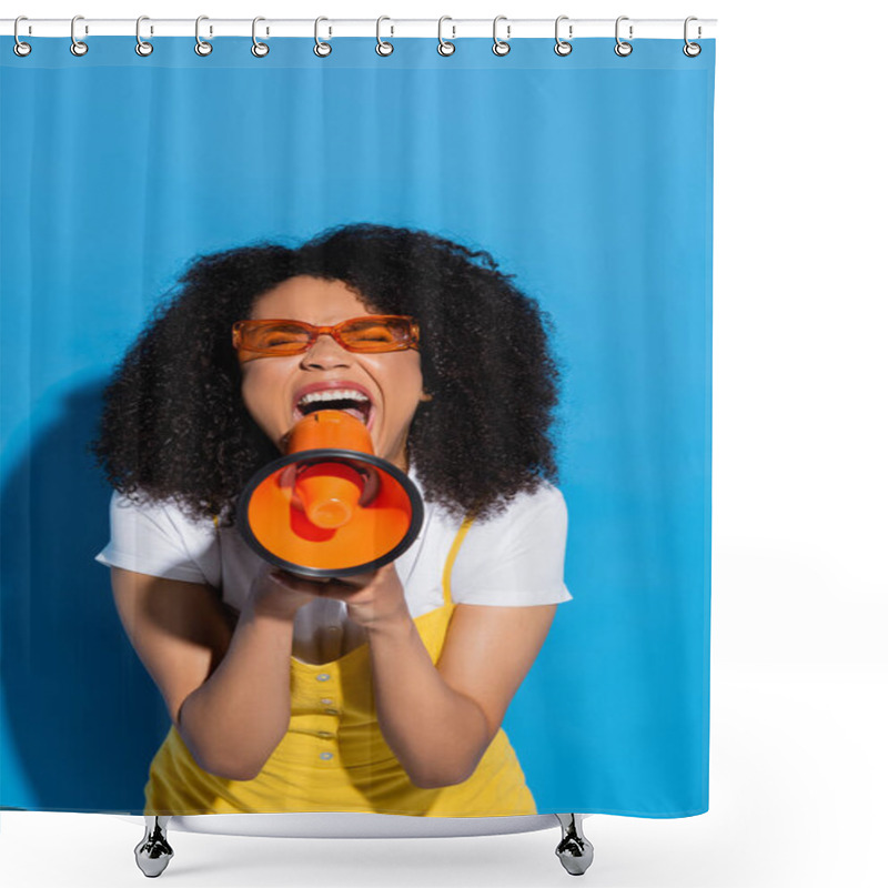 Personality  Thrilled African American Woman In Orange Eyeglasses Screaming In Megaphone On Blue Shower Curtains