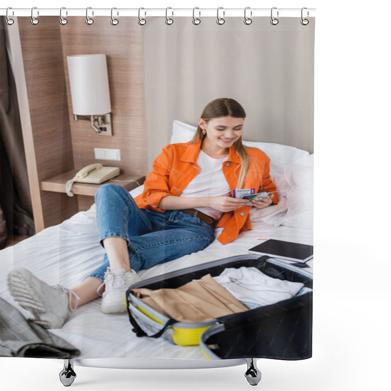 Personality  Joyful Woman Holding Passport, Boarding Pass And Air Ticket Near Baggage And Notebook On Bed In Hotel  Shower Curtains