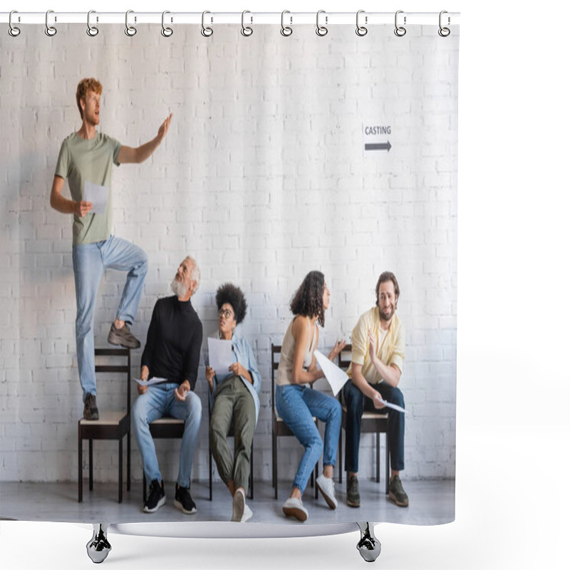 Personality  Redhead Man Standing On Chair And Rehearsing Near Multiethnic Actors Sitting And Waiting For Casting Shower Curtains