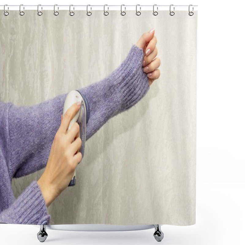 Personality  The Girl Cleans A Knitted Wool Sweater With A Electric Fabric Shaver To Remove Pellets, Small Lumps That Have Piled On The Surface Of Clothing Shower Curtains