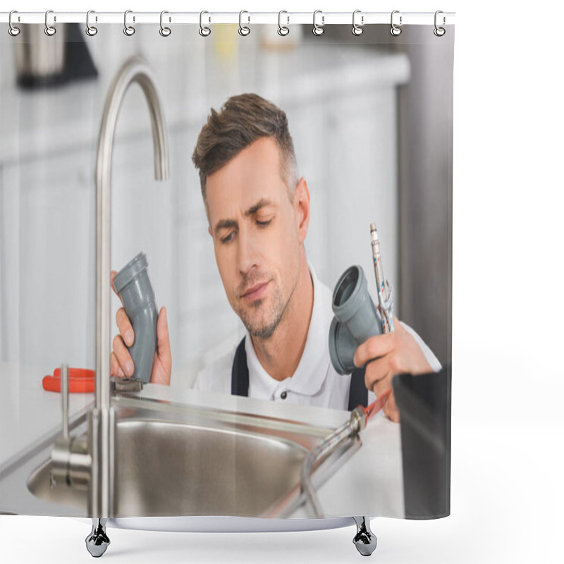 Personality  Thoughtful Adult Repairman Holding Pipes And Tools While Repairing Faucet At Kitchen  Shower Curtains