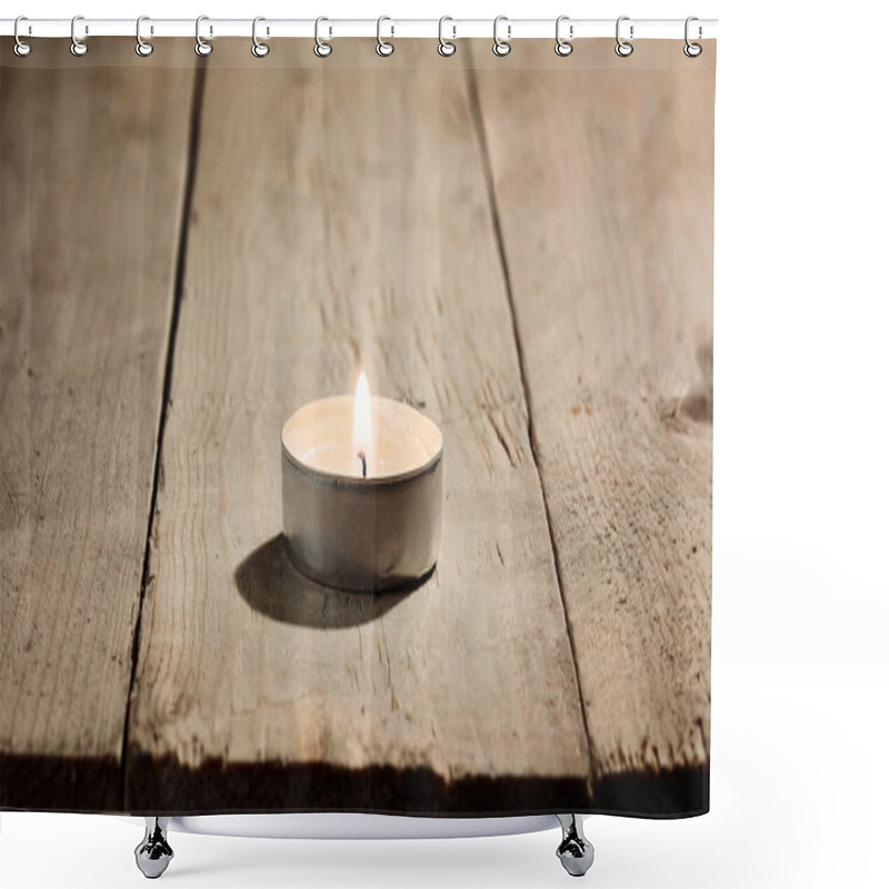 Personality  Lonely Small Lighted Burning Round Candle On A Wooden Background Of Rough Untreated Pine Boards. Macro Photography With Great Depth Of Field Shower Curtains