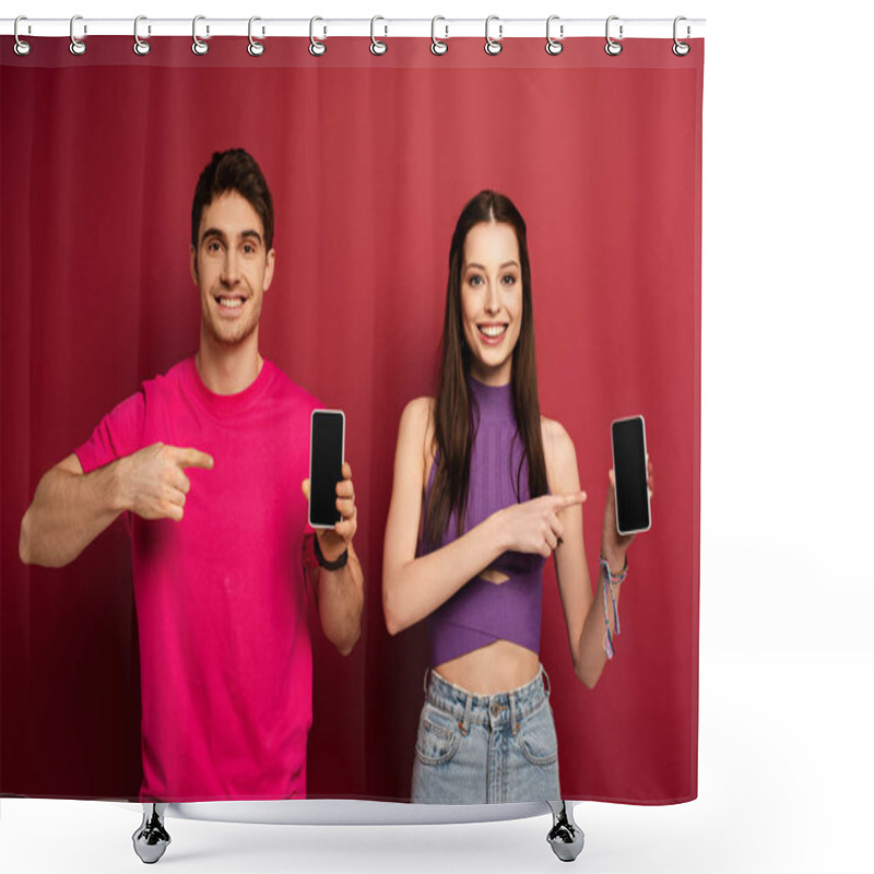 Personality  Smiling Couple Pointing At Smartphones With Blank Screens On Red Shower Curtains