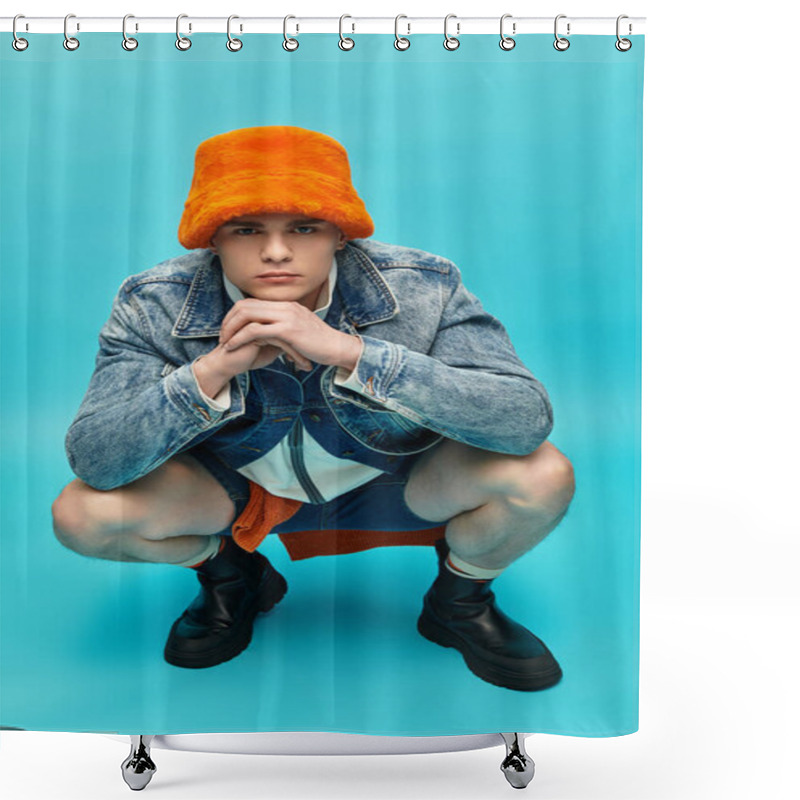 Personality  A Young Man Confidently Squats In Stylish Clothes, Sporting A Standout Bright Orange Hat. Shower Curtains