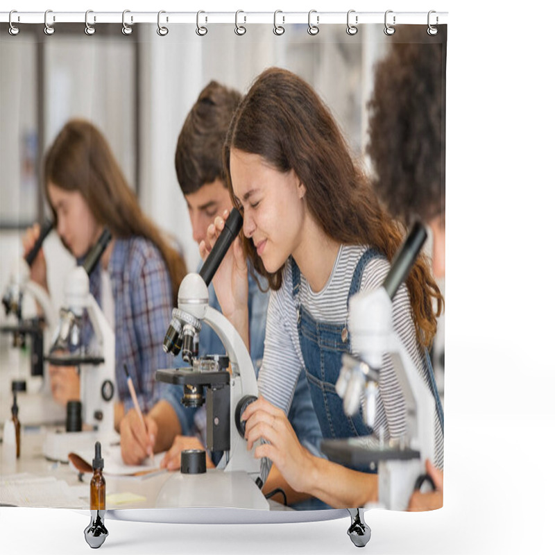 Personality  Group Of Multiethnic College Students Performing Experiment Using Microscope In Science Lab. University Focused Student Looking Through Microscope In Biology Class While Sitting In A Row At Desk. High School Girl Examine Samples During Lecture. Shower Curtains