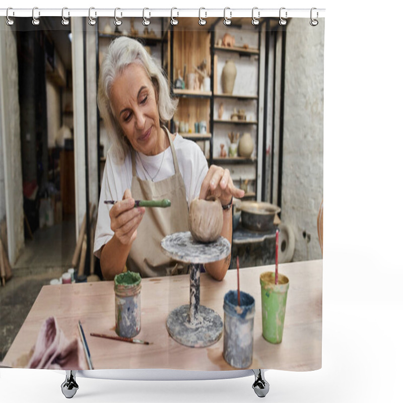 Personality  The Mature Woman Skillfully Shapes Clay While Smiling In Her Inviting Artisan Studio. Shower Curtains