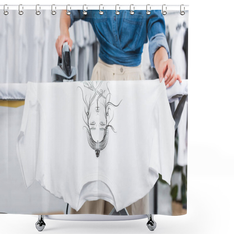 Personality  Cropped Image Of Female Designer Ironing T-shirt With Print In Clothing Design Studio Shower Curtains